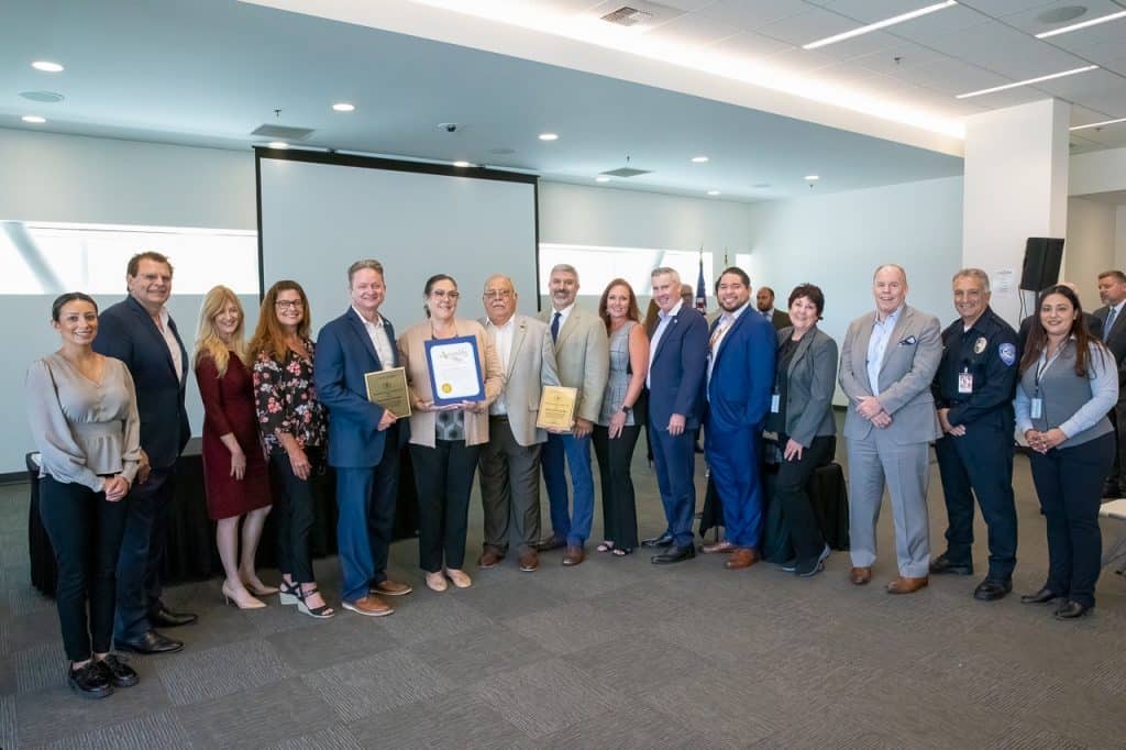 Photo of staff members from IVDA holding EPA Award