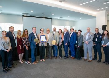 Photo of staff members from IVDA holding EPA Award